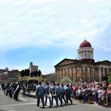 Eighth Veterans Reserve Corps follow behind the Lincoln hearse at the Old State Capitol