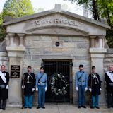 Pallbearers and members of the Veterans Reserve Corps stand at attention in front of the original receiving vault where Lincoln's casket was placed